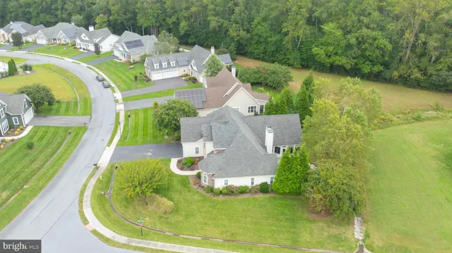a view of a sign board with a yard