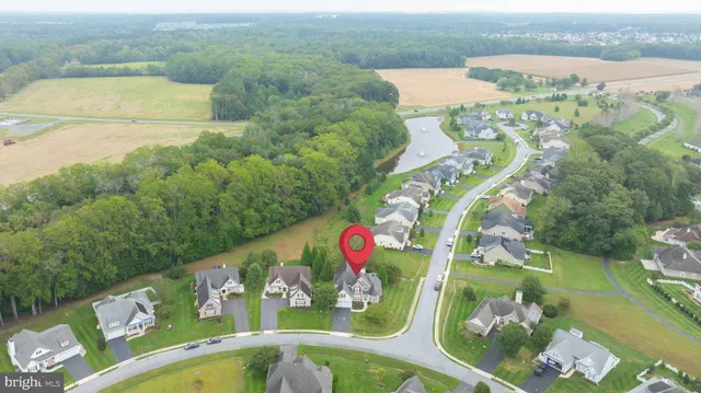 a large white kitchen with lots of counter top space and living room