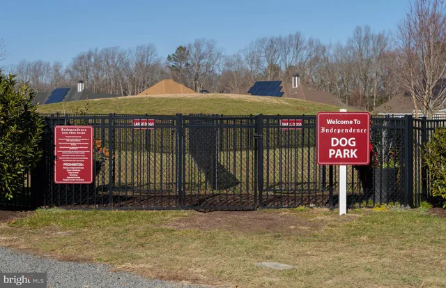 a living room with furniture pool table and flat screen tv