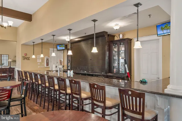 a view of a dining room with furniture and window