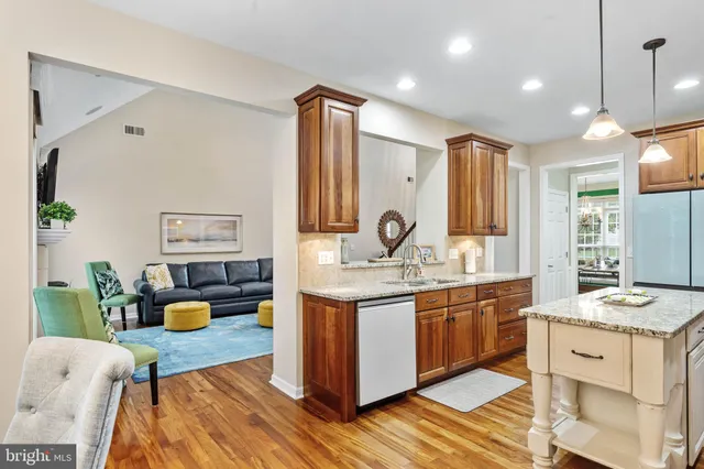 a living room with furniture a dining table and chairs