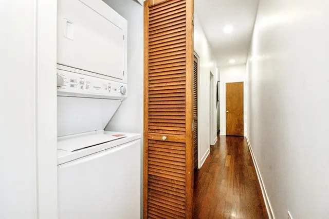 a view of a hallway with washer and dryer