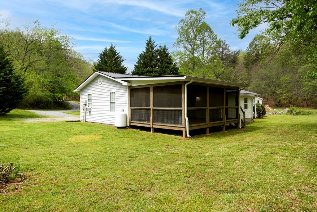6491 Crooked Creek Road Young Harris, GA 30582 - Photo 11 of 59 a view of a house with a backyard