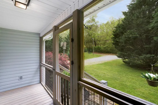 a living room with furniture fireplace and flat screen tv