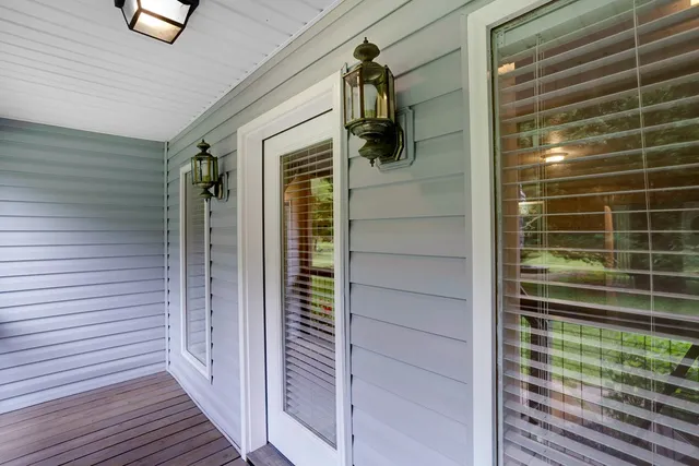 a view of a kitchen with a stove wooden cabinets and a refrigerator