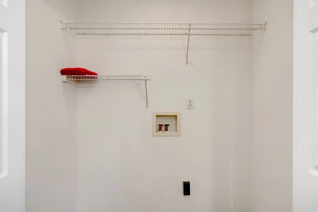 a view of hallway with wooden floor