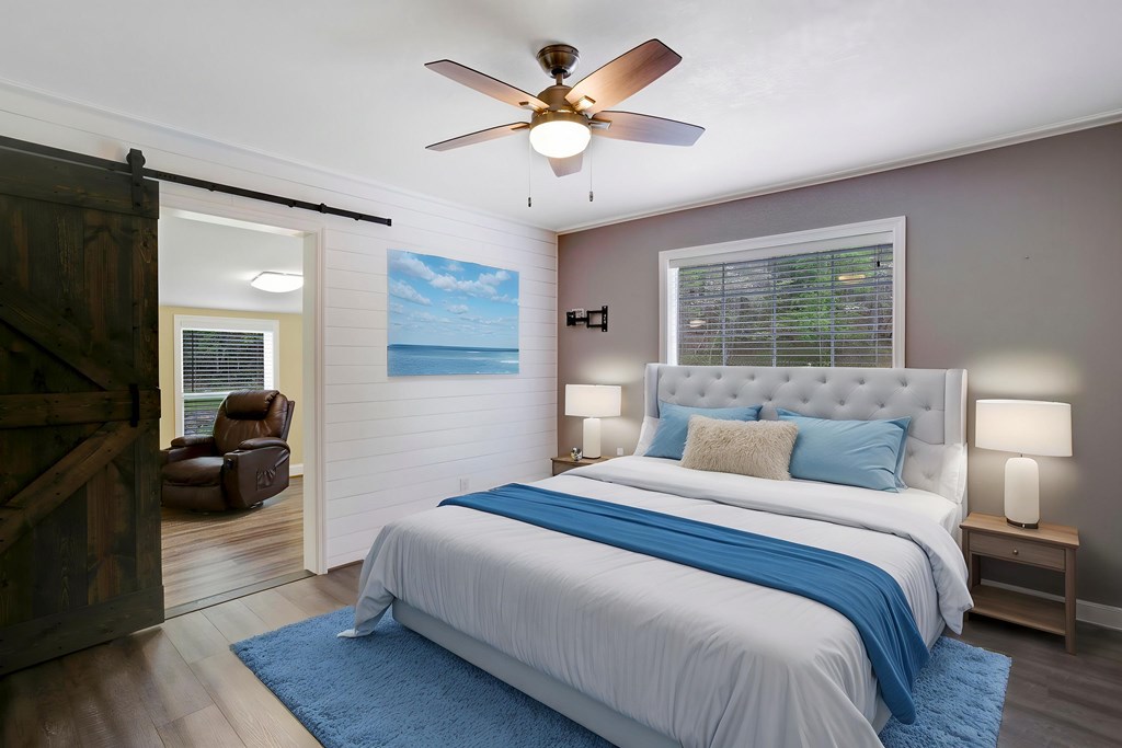 6491 Crooked Creek Road Young Harris, GA 30582 - Photo 30 of 59 a bedroom with a bed and a chandelier