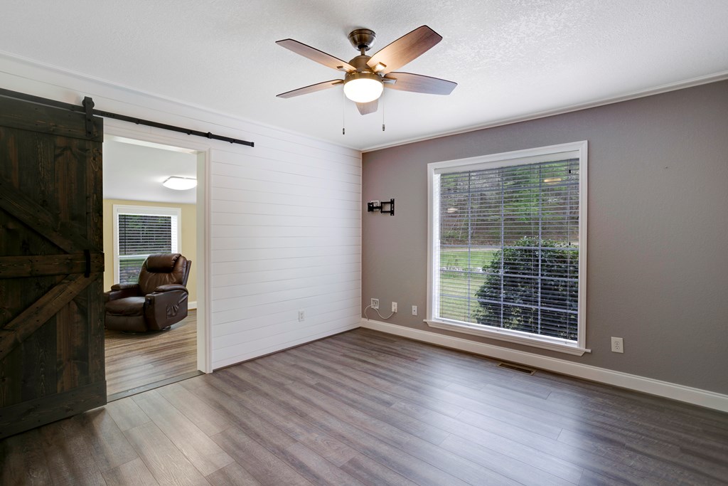 6491 Crooked Creek Road Young Harris, GA 30582 - Photo 31 of 59 wooden floor in an empty room with a window