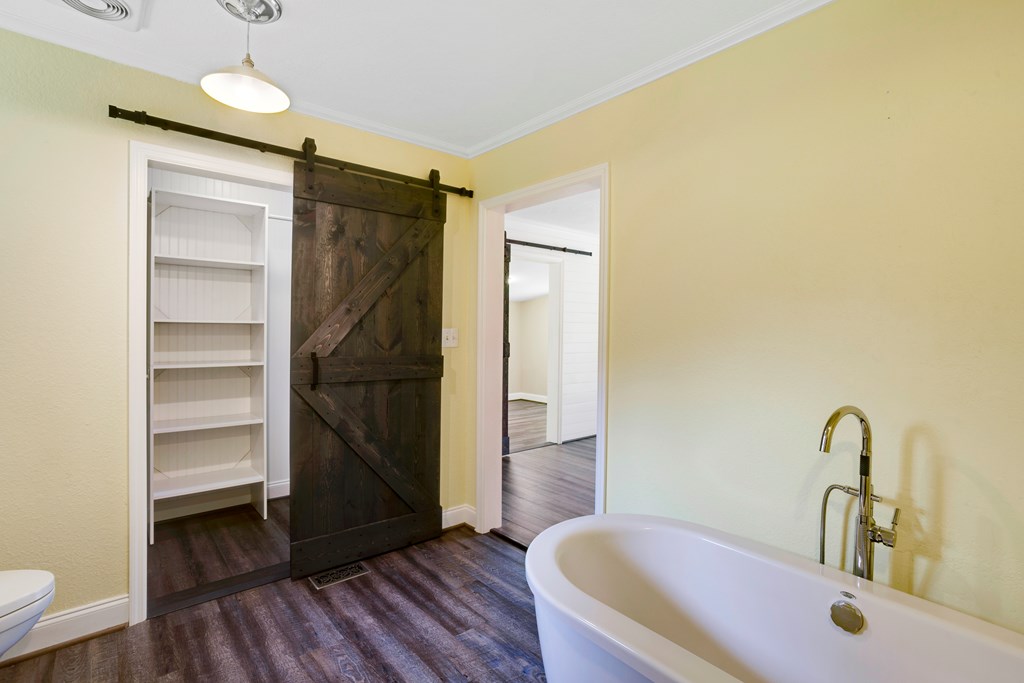 6491 Crooked Creek Road Young Harris, GA 30582 - Photo 34 of 59 a bathroom with a sink and a tub