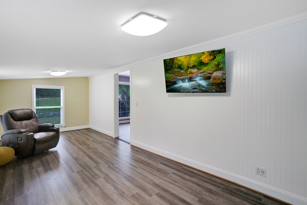 6491 Crooked Creek Road Young Harris, GA 30582 - Photo 36 of 59 a living room with furniture and a flat screen tv