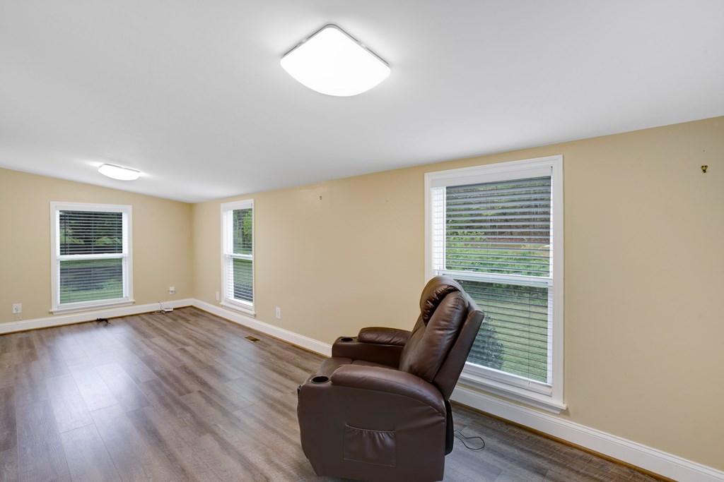 6491 Crooked Creek Road Young Harris, GA 30582 - Photo 37 of 59 a living room with furniture and a window