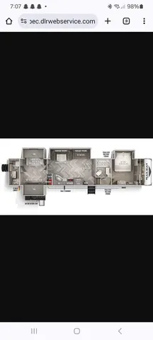 a view of kitchen with sink window and cabinets