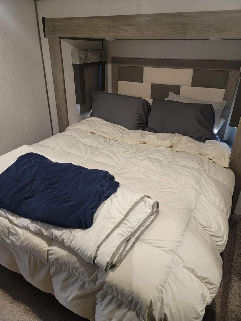 6491 Crooked Creek Road Young Harris, GA 30582 - Photo 42 of 59 a bed sitting in a bedroom and wooden floor