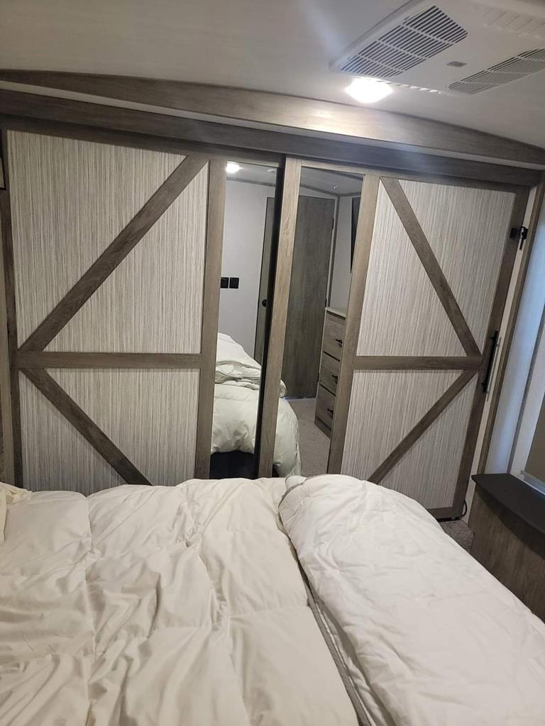 6491 Crooked Creek Road Young Harris, GA 30582 - Photo 43 of 59 a bedroom with a bed and wooden floor