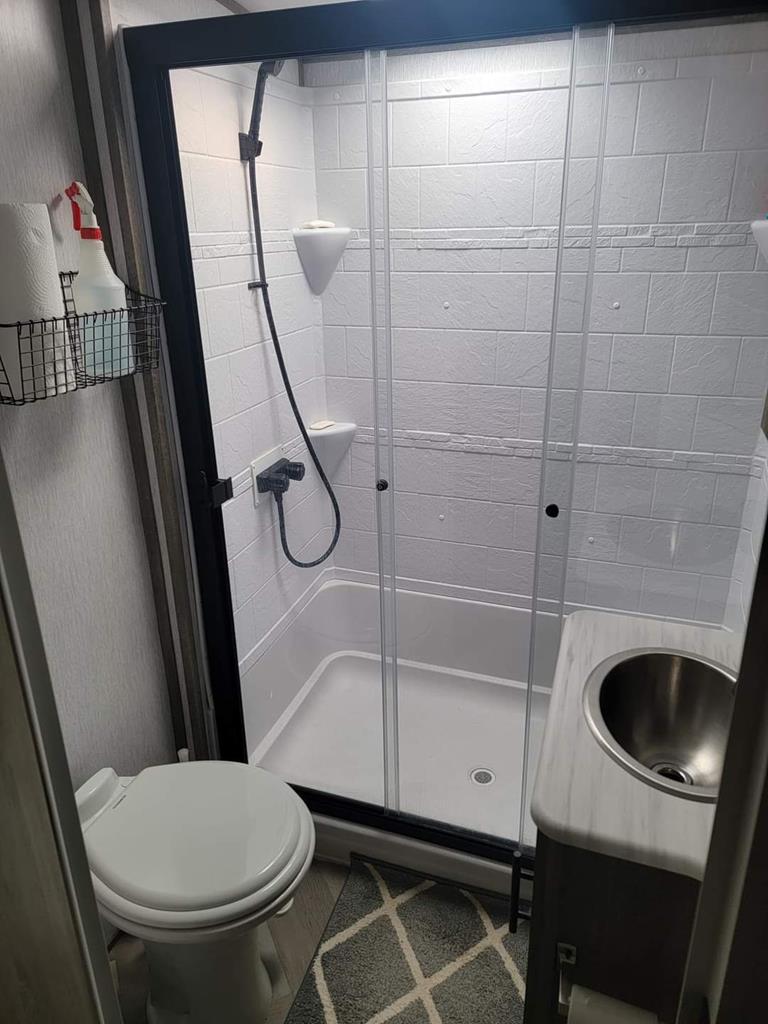 6491 Crooked Creek Road Young Harris, GA 30582 - Photo 46 of 59 a bathroom with a toilet and a sink