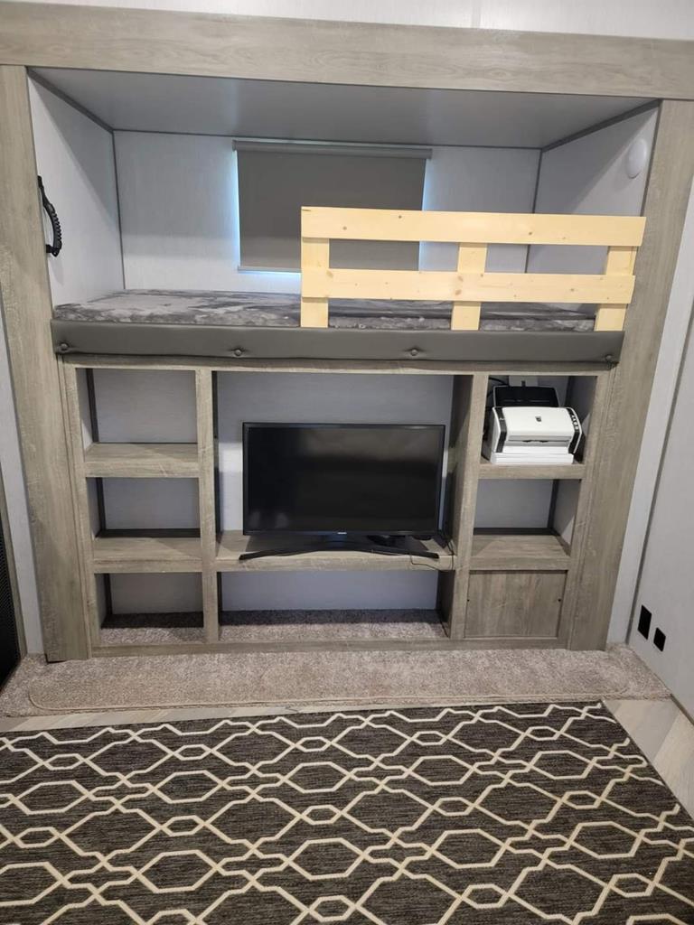 6491 Crooked Creek Road Young Harris, GA 30582 - Photo 47 of 59 a living room with a fireplace and a rug