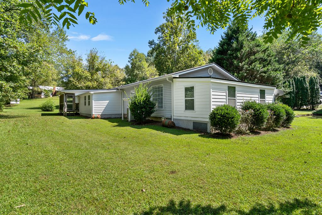 6491 Crooked Creek Road Young Harris, GA 30582 - Photo 49 of 59 a front view of house with yard and green space