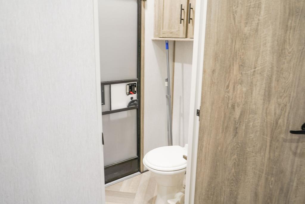 6491 Crooked Creek Road Young Harris, GA 30582 - Photo 59 of 59 a white toilet sitting next to a shower curtain