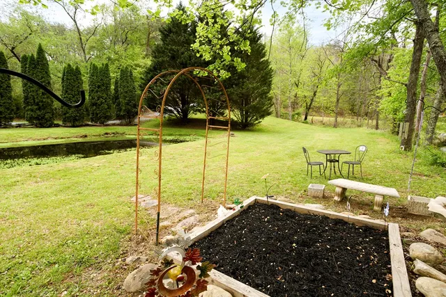 a view of a house with a backyard