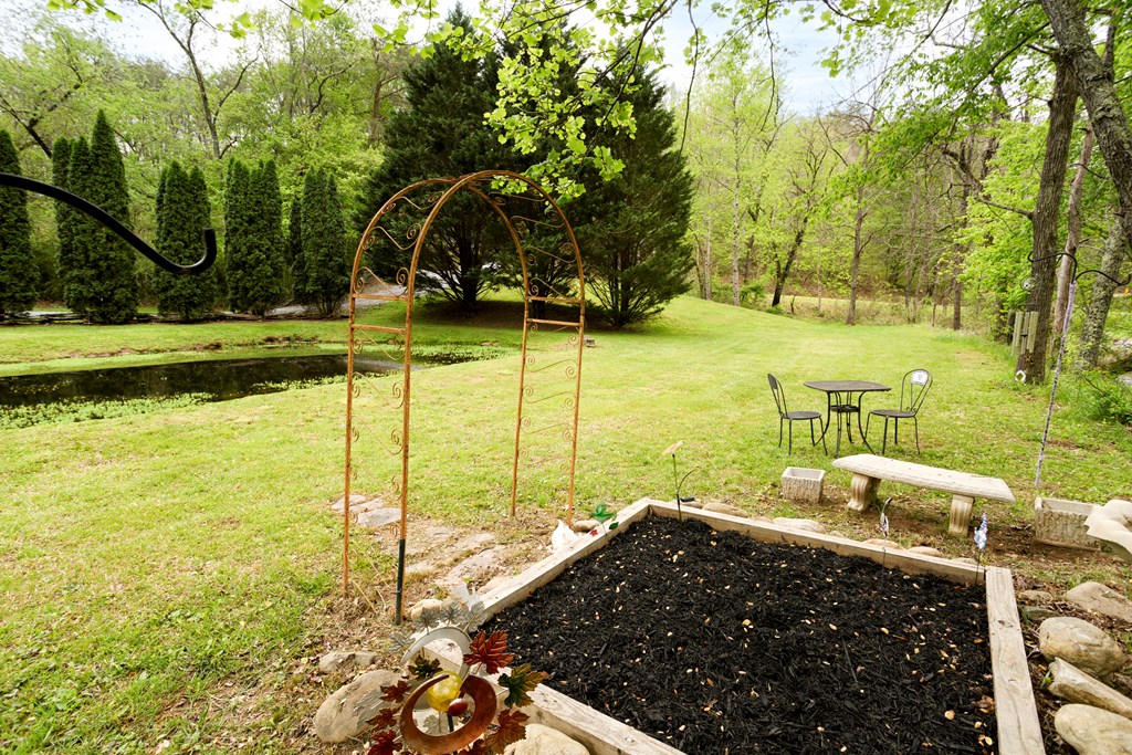 6491 Crooked Creek Road Young Harris, GA 30582 - Photo 10 of 59 a view of a swimming pool with a patio and a yard