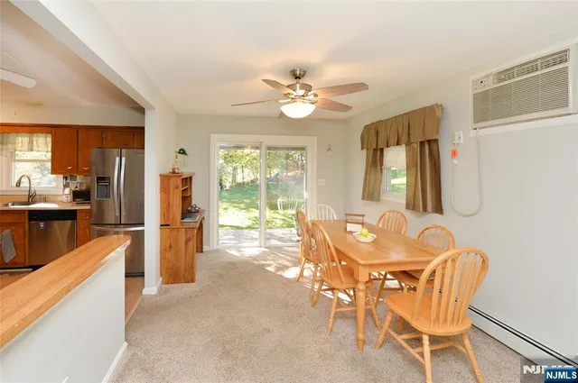 a dining room with furniture and window