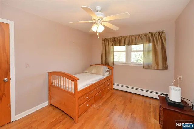 a room with a bed and window