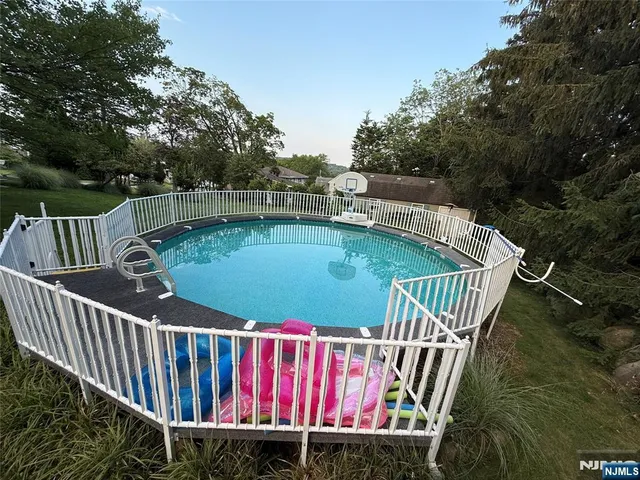 a view of balcony with wooden floor and outdoor seating