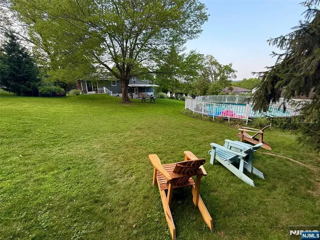 a view of a table and chairs in the garden