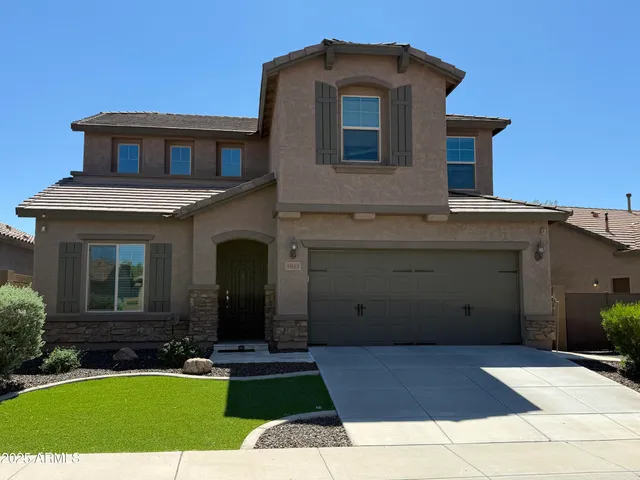 a view of a building with a yard