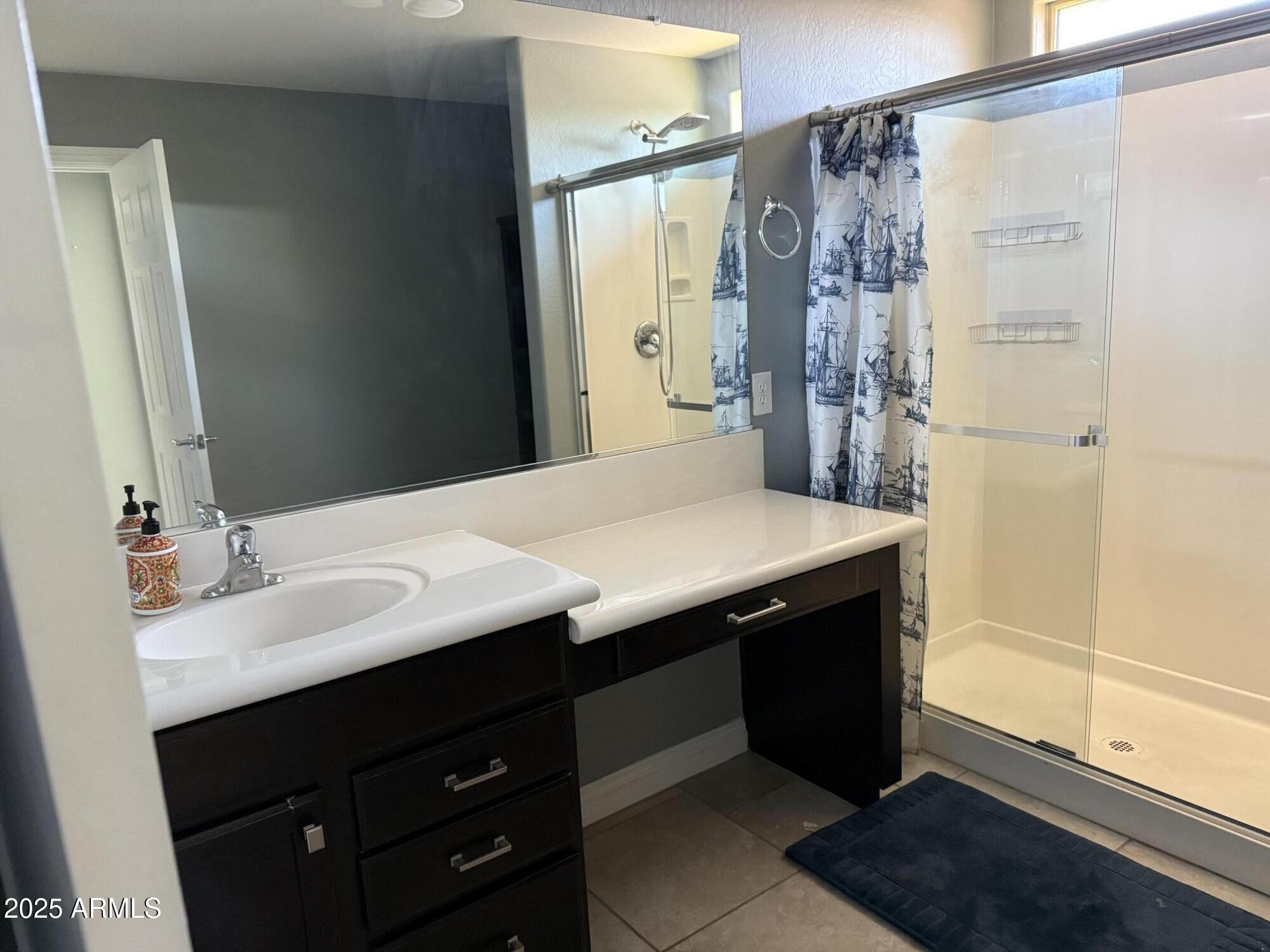 1843 West Fetlock Trail Phoenix, AZ 85085 - Photo 13 of 36 a bathroom with a sink and a mirror