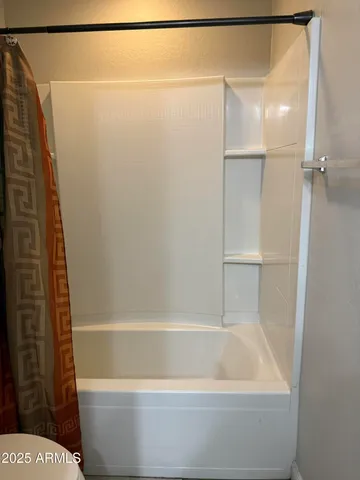 a bathroom with a bathtub