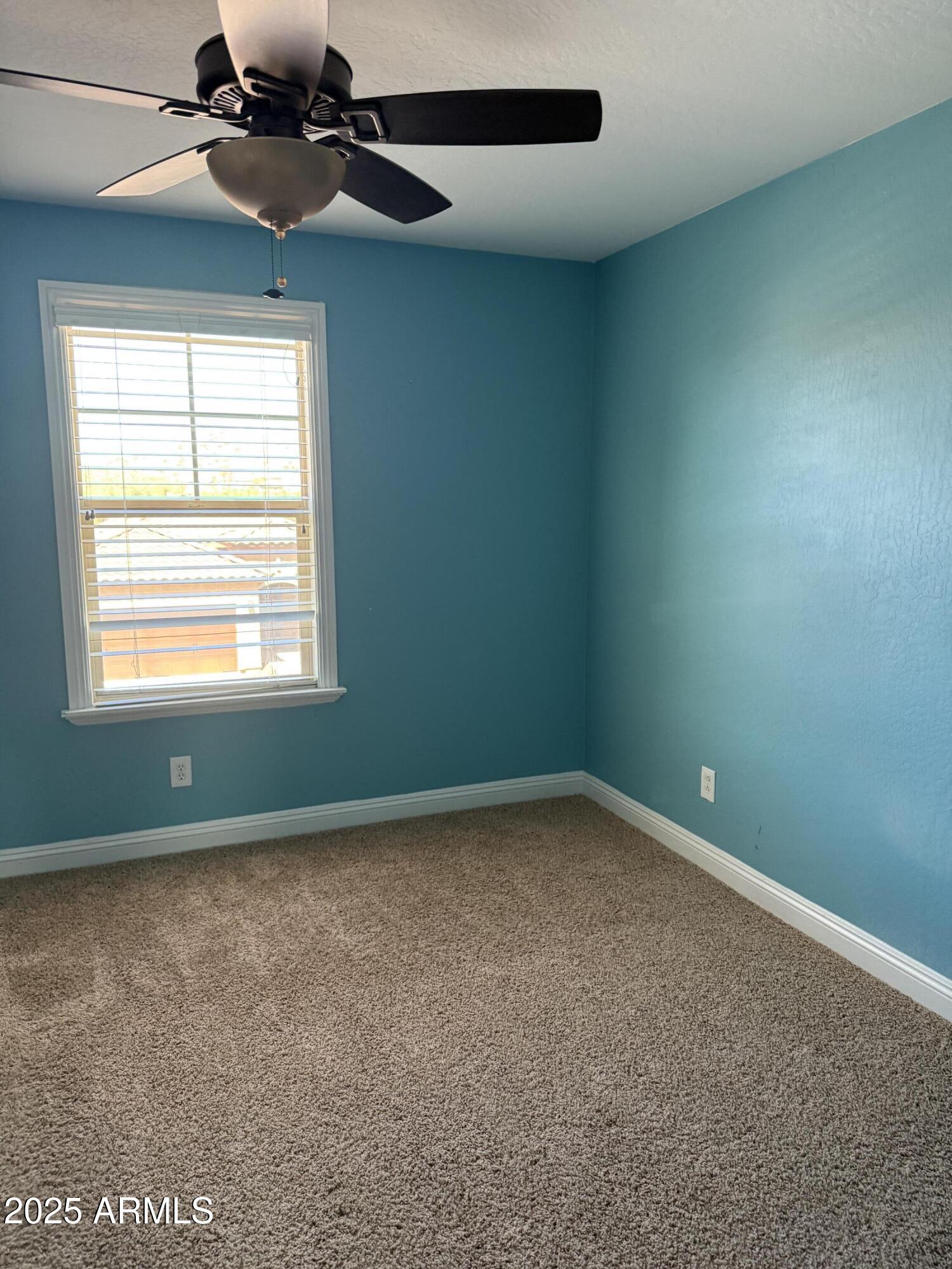 1843 West Fetlock Trail Phoenix, AZ 85085 - Photo 22 of 36 a view of an empty room with a window