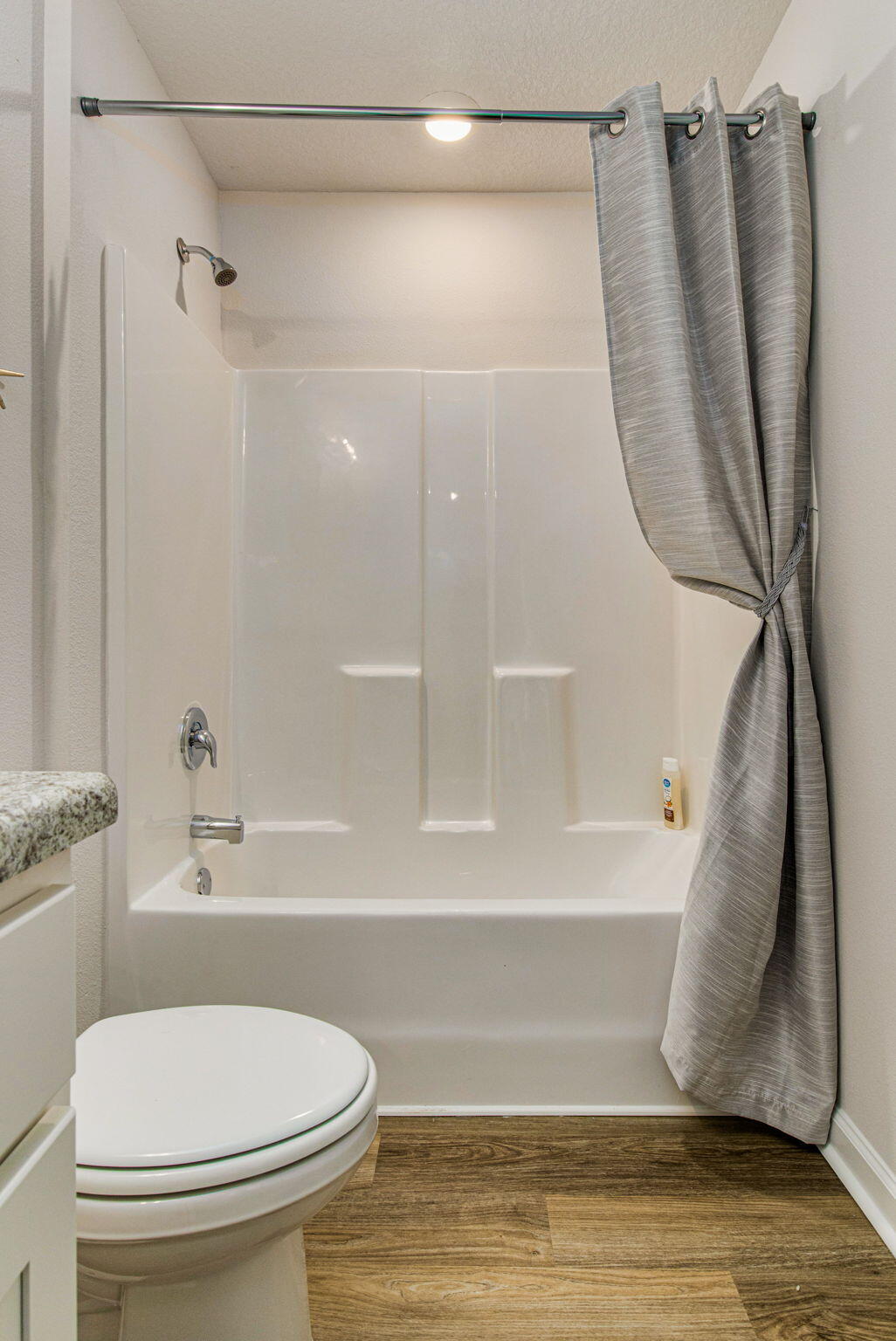 6357 Firefly Drive Milton, FL 32583 - Photo 18 of 37 a bathroom with a toilet and a shower