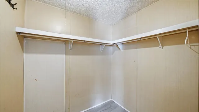 a view of an empty walk in closet