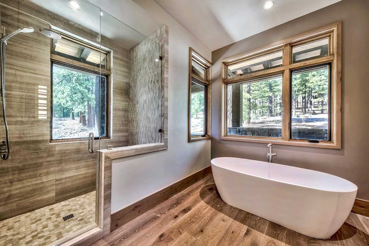 7565 Lahontan Drive Truckee, CA 96161 - Photo 19 of 21 a bathroom with a bathtub and windows
