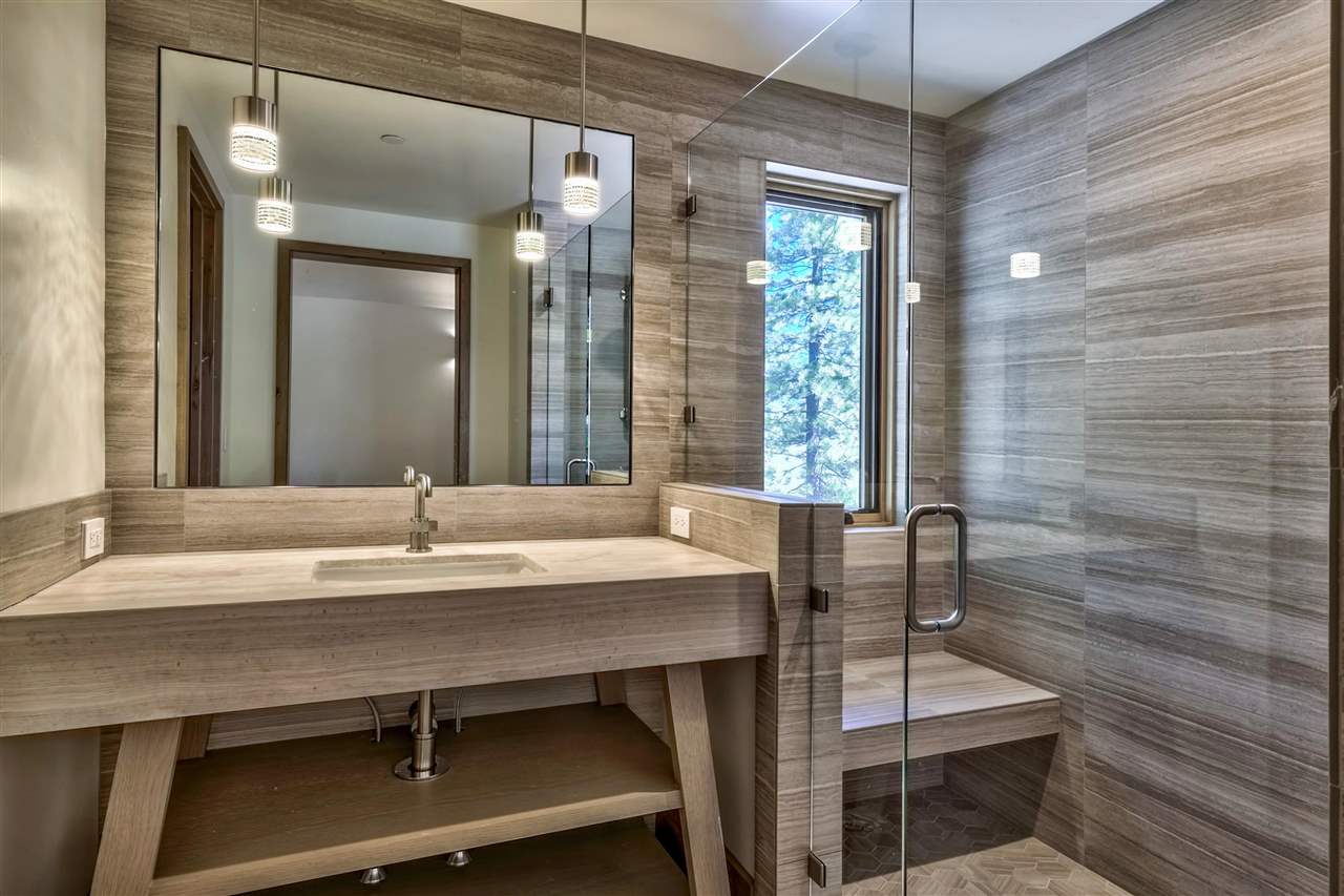 7565 Lahontan Drive Truckee, CA 96161 - Photo 20 of 21 a dining room with table chairs and chandelier