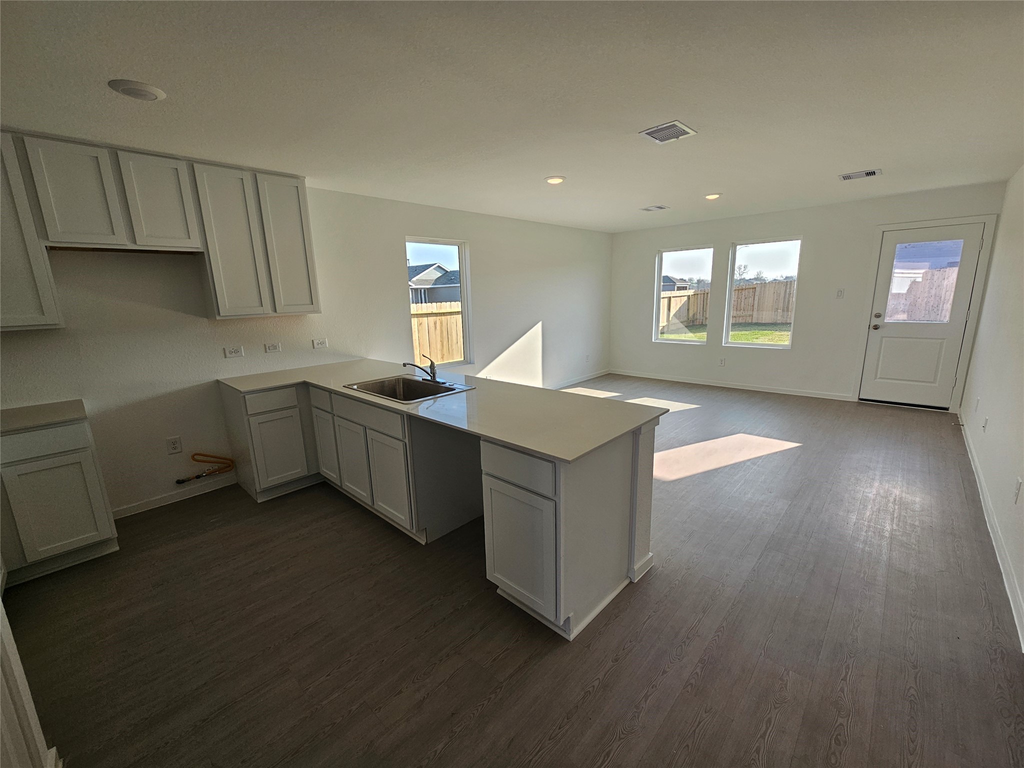 404 Nicholas Road Wharton, TX 77488 - Photo 11 of 19 a kitchen with stainless steel appliances a sink dishwasher a stove a refrigerator with wooden cabinets