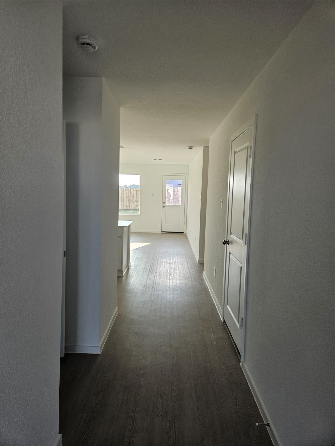 404 Nicholas Road Wharton, TX 77488 - Photo 4 of 19 a view of a hallway with wooden floor