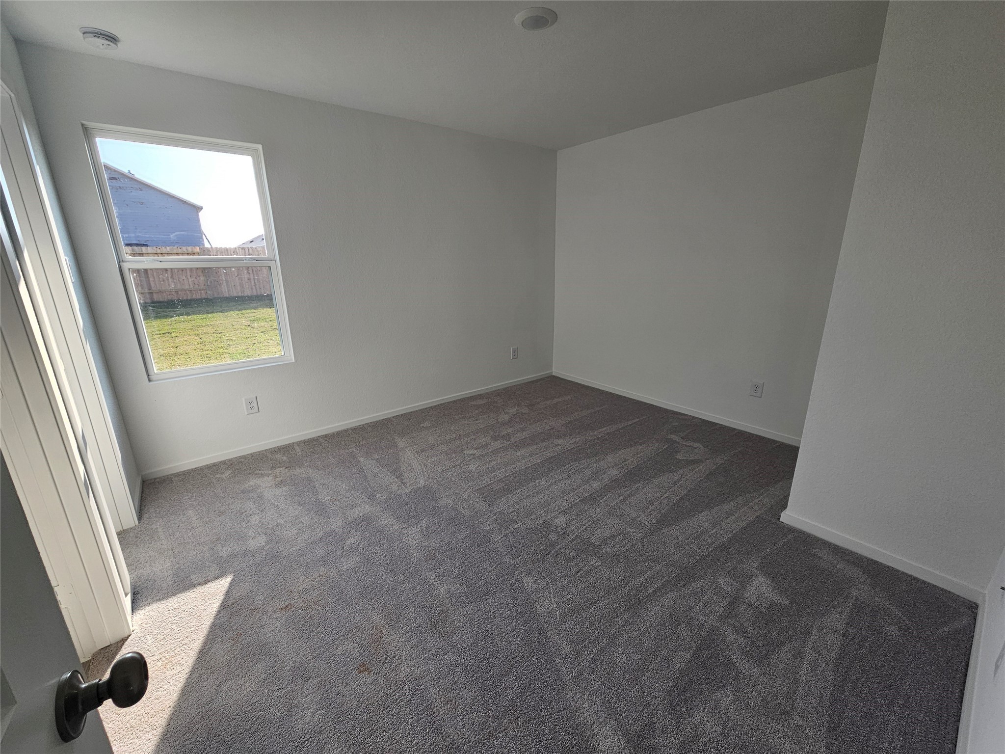 404 Nicholas Road Wharton, TX 77488 - Photo 8 of 19 an empty room with a window