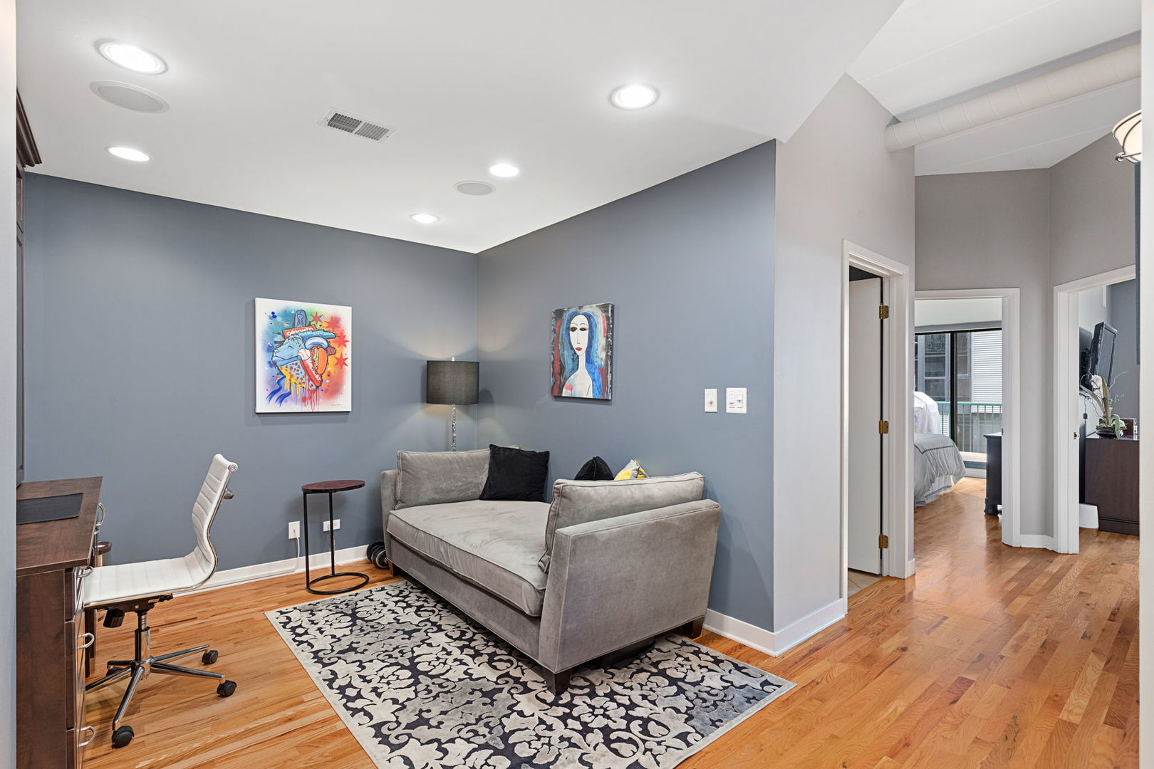 841 West Monroe Street, Unit 4B Chicago, IL 60607 - Photo 17 of 25 a living room with furniture and a rug