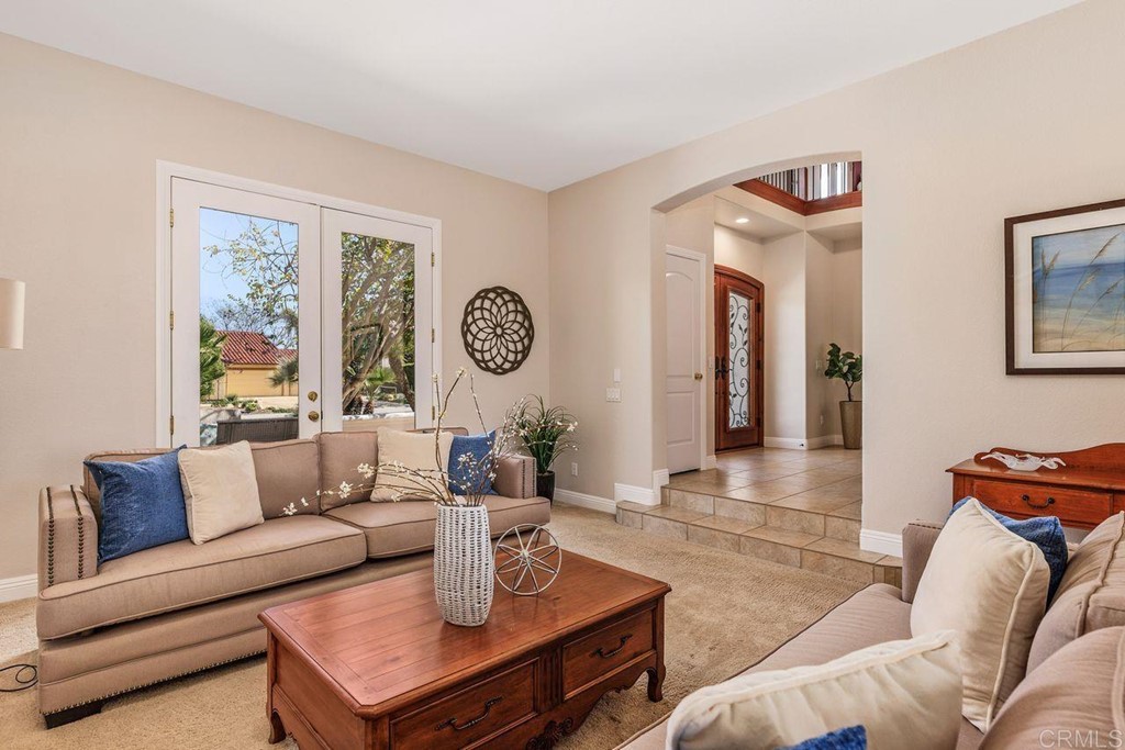 7915 Corte Penca Carlsbad, CA 92009 - Photo 9 of 50 a living room with furniture and a window