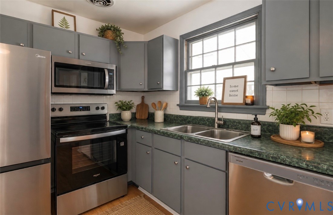 20100 Frog Level Road Ruther Glen, VA 22546 - Photo 4 of 28 Grey cabinetry, stainless steel appliances, dual b