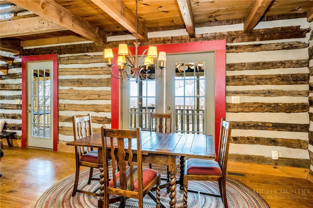 1992 Homestead Road Todd, NC 28684 - Photo 12 of 44 a view of a dining room with furniture and wooden floor