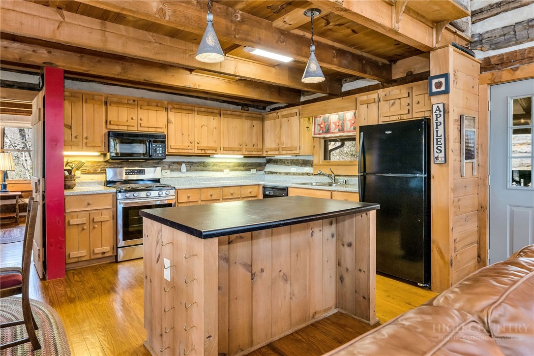 1992 Homestead Road Todd, NC 28684 - Photo 14 of 44 a kitchen with stainless steel appliances granite countertop a stove and a refrigerator