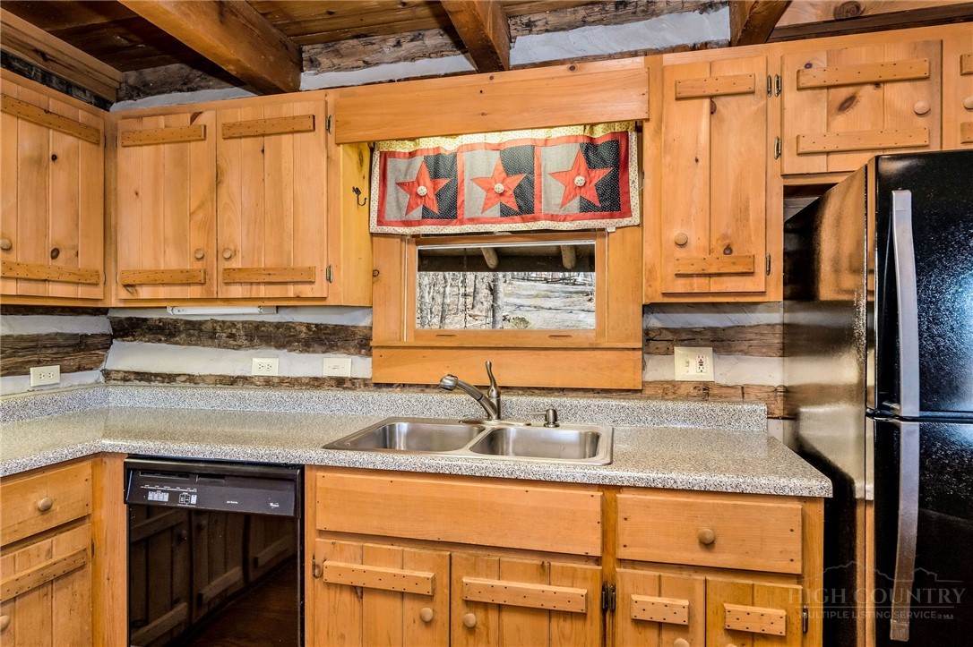 1992 Homestead Road Todd, NC 28684 - Photo 17 of 44 a kitchen with stainless steel appliances granite countertop a sink and a stove