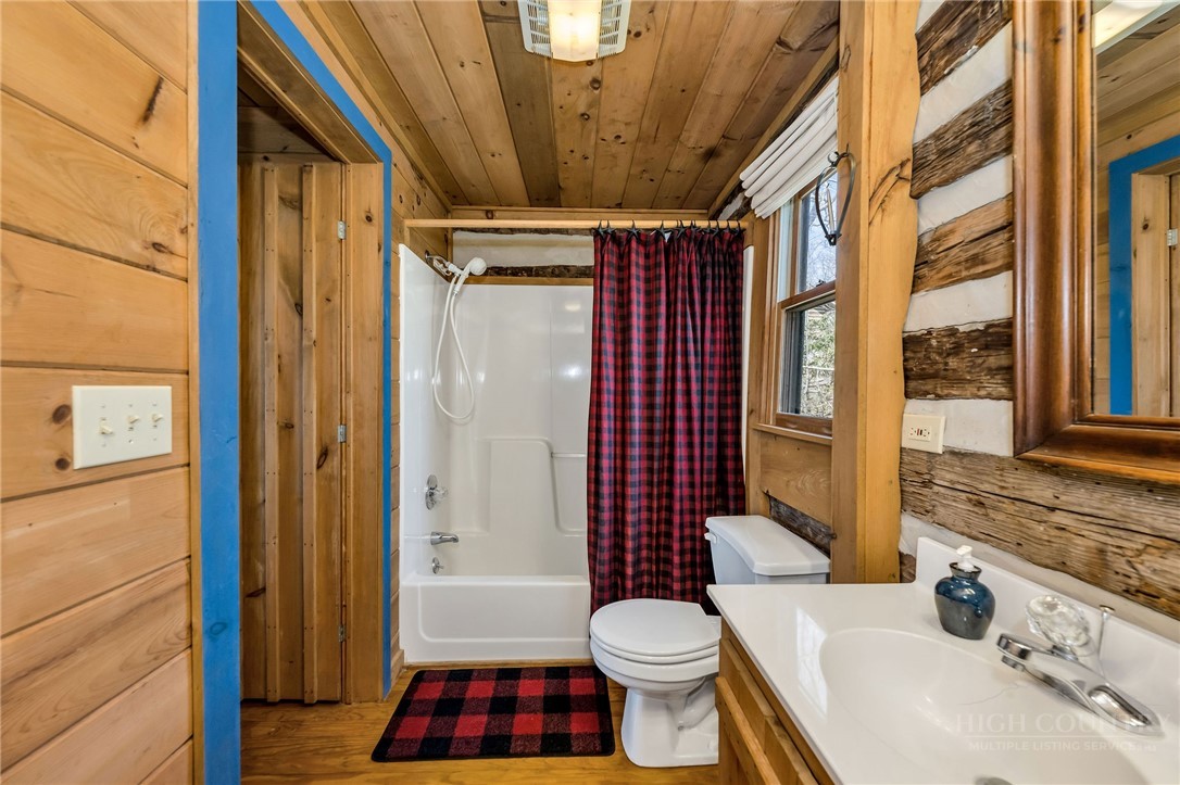1992 Homestead Road Todd, NC 28684 - Photo 23 of 44 a bathroom with a sink toilet and shower