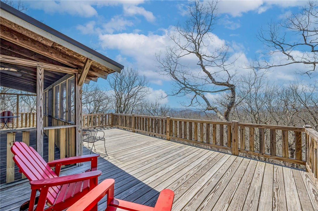 1992 Homestead Road Todd, NC 28684 - Photo 26 of 44 a balcony with hardwood filled with table and chairs