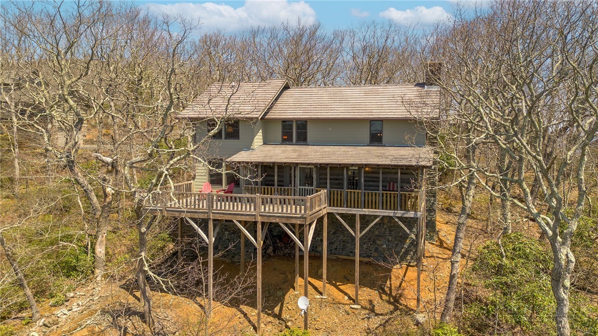 1992 Homestead Road Todd, NC 28684 - Photo 41 of 44 front view of a house with a garden