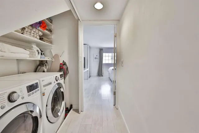 a view of storage and utility room with washer and dryer
