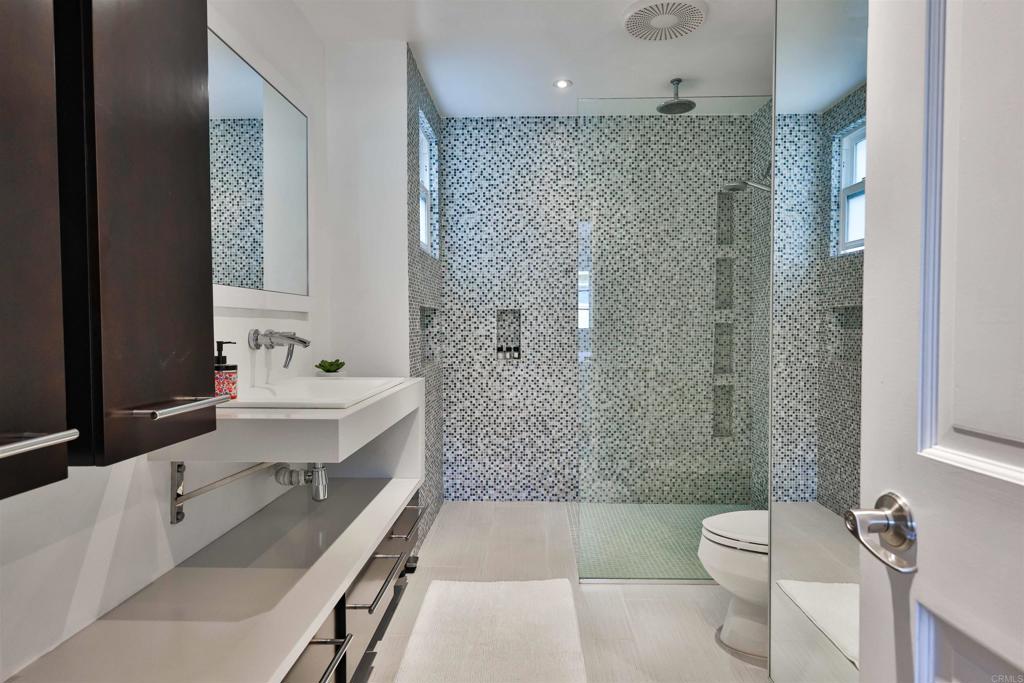 942 D Avenue, Unit B Coronado, CA 92118 - Photo 16 of 38 a bathroom with a sink a toilet and shower